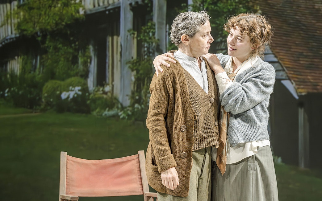 Performers in Grace Pervades West End show scene with garden backdrop.