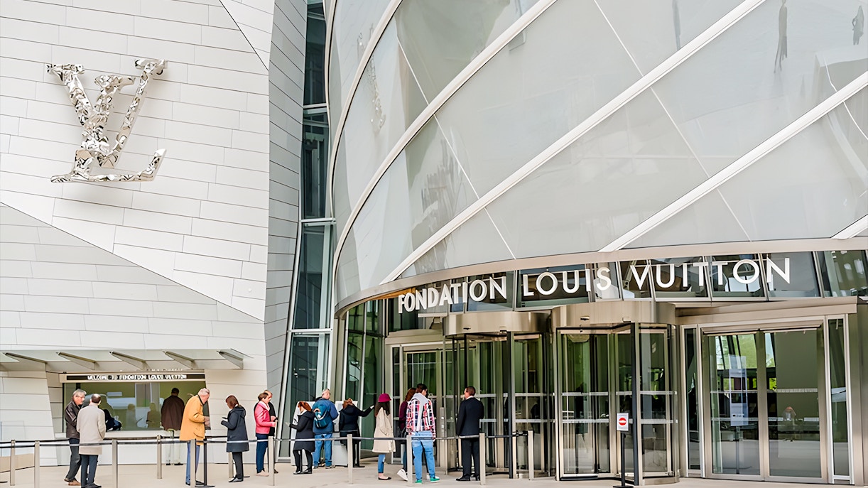 Visitors entering Fondation Louis Vuitton in Paris for VIP entry and history tour.