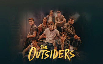 Cast of The Outsiders Broadway show in a group pose.