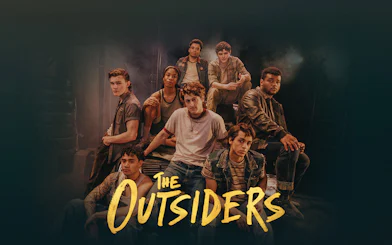 Cast of The Outsiders Broadway show in a group pose.