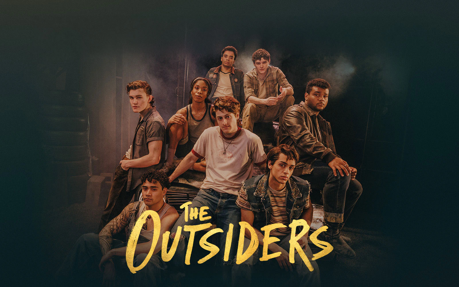 Cast of The Outsiders Broadway show in a group pose.