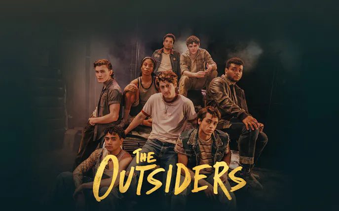 Cast of The Outsiders Broadway show in a group pose.