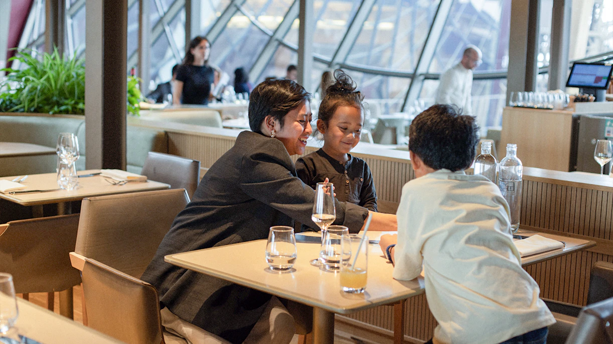 Lunch at Madame Brasserie, Eiffel Tower, with diners enjoying a meal.