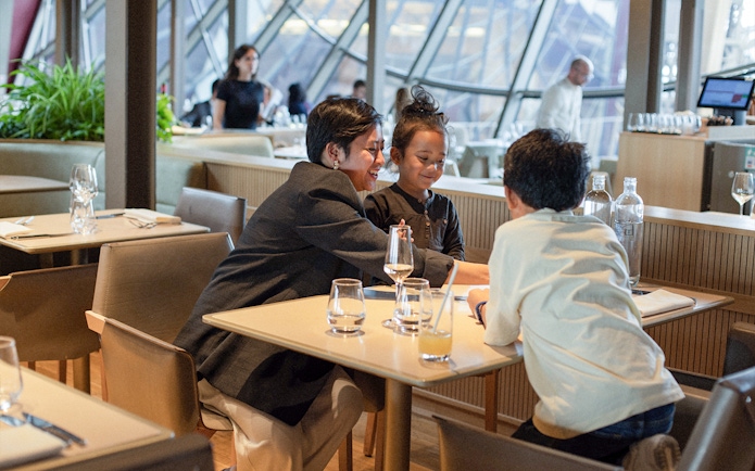 Lunch at Madame Brasserie, Eiffel Tower, with diners enjoying a meal.