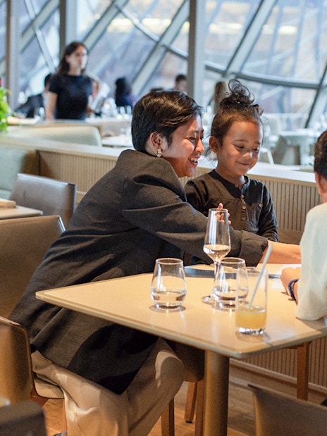 Lunch at Madame Brasserie, Eiffel Tower, with diners enjoying a meal.