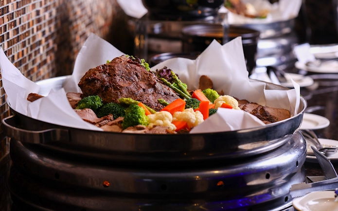 Buffet with roasted meat and vegetables at ARAS restaurant, KL Tower, Kuala Lumpur.