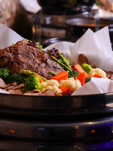 Buffet with roasted meat and vegetables at ARAS restaurant, KL Tower, Kuala Lumpur.