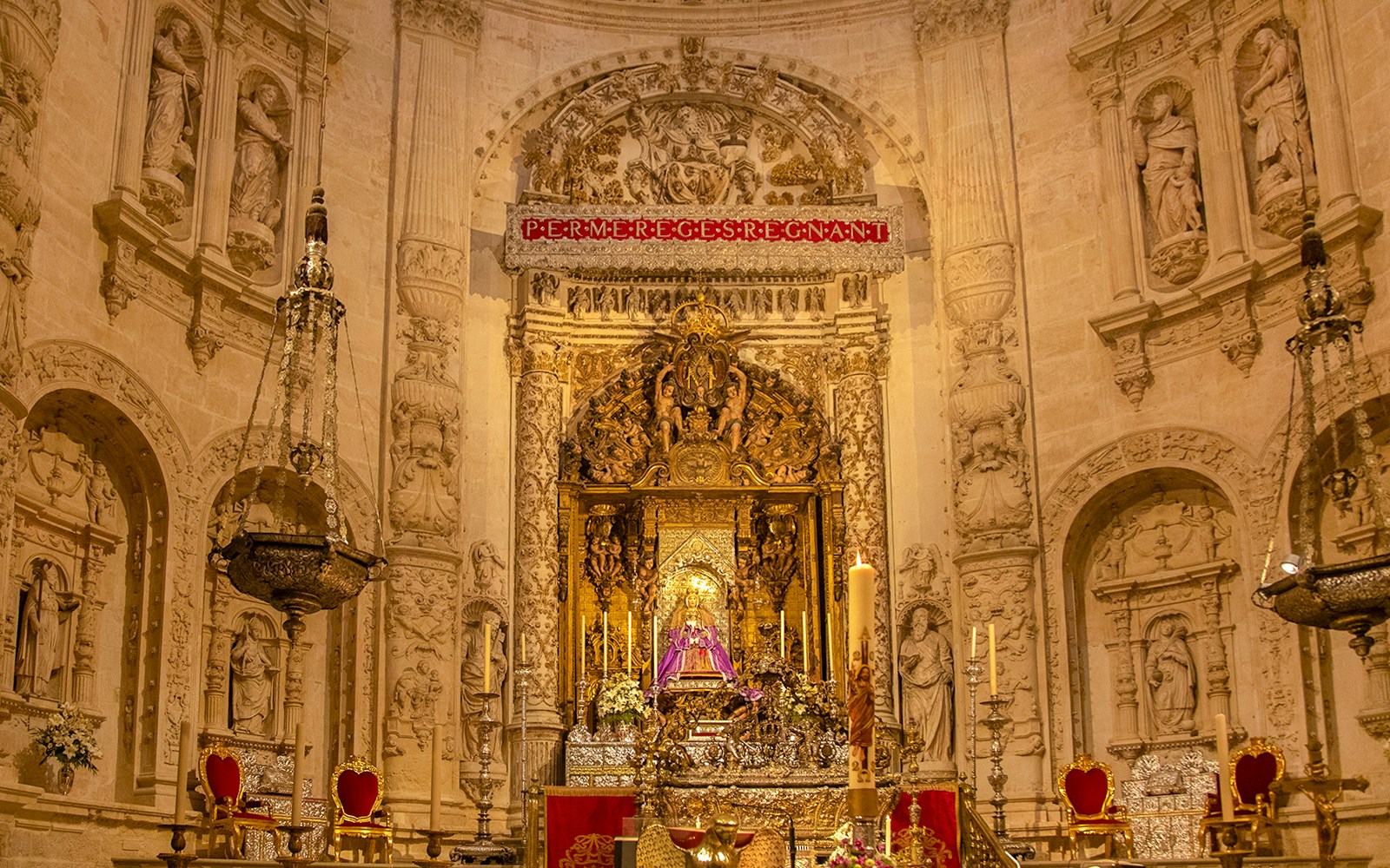 Seville Cathedral Royal Chapel interior with ornate altar and Gothic architecture.