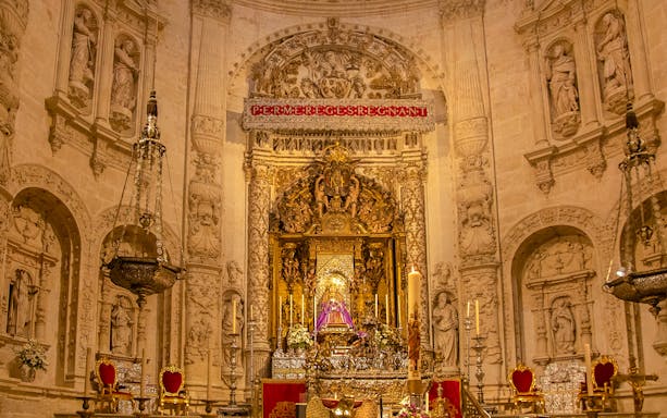Seville Cathedral Royal Chapel interior with ornate altar and Gothic architecture.