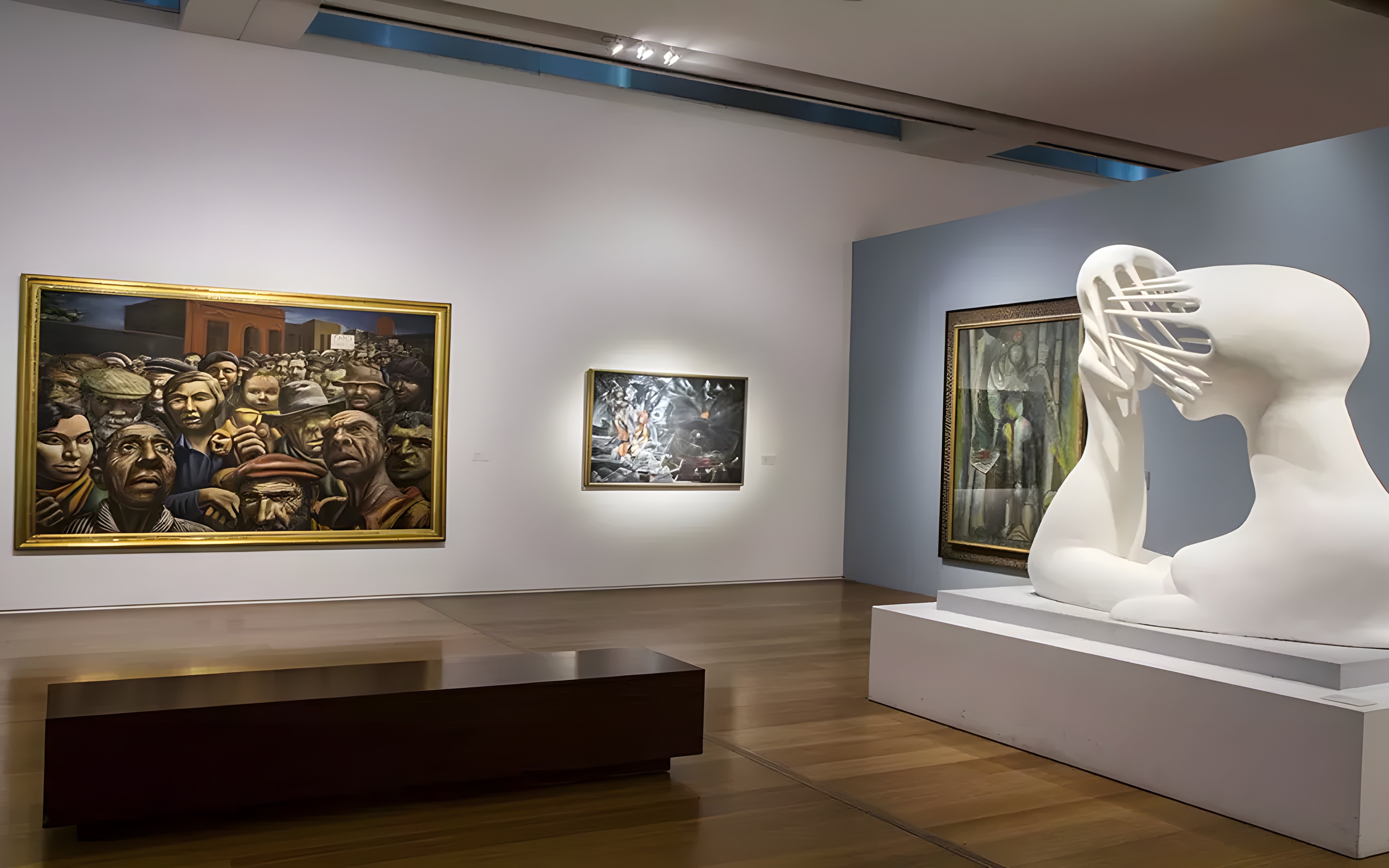 Exhibits at Museum of Latin American Art featuring paintings and a white abstract sculpture.