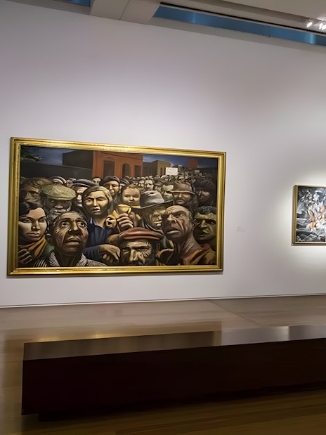 Exhibits at Museum of Latin American Art featuring paintings and a white abstract sculpture.