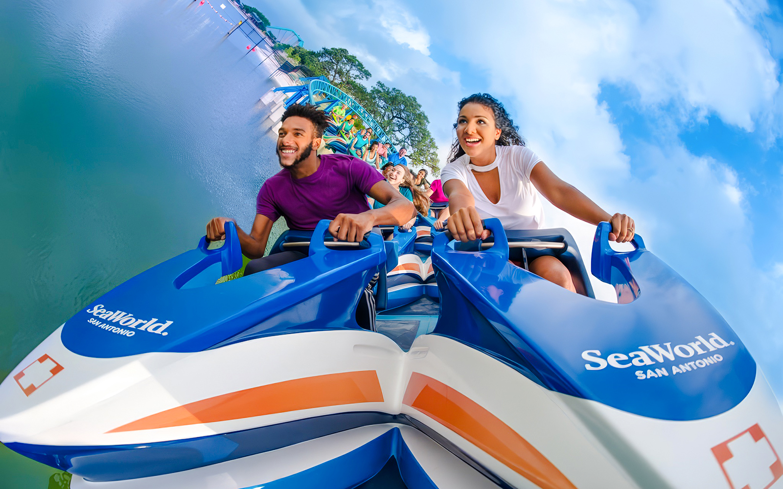 Riders enjoying Wave Breaker: The Rescue Coaster at SeaWorld San Antonio.