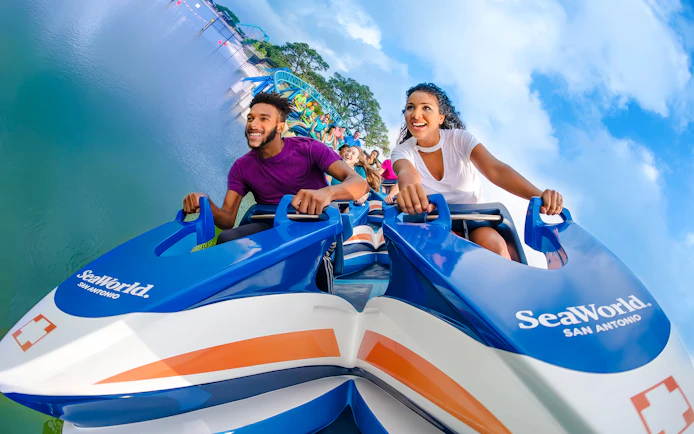 Riders enjoying Wave Breaker: The Rescue Coaster at SeaWorld San Antonio.