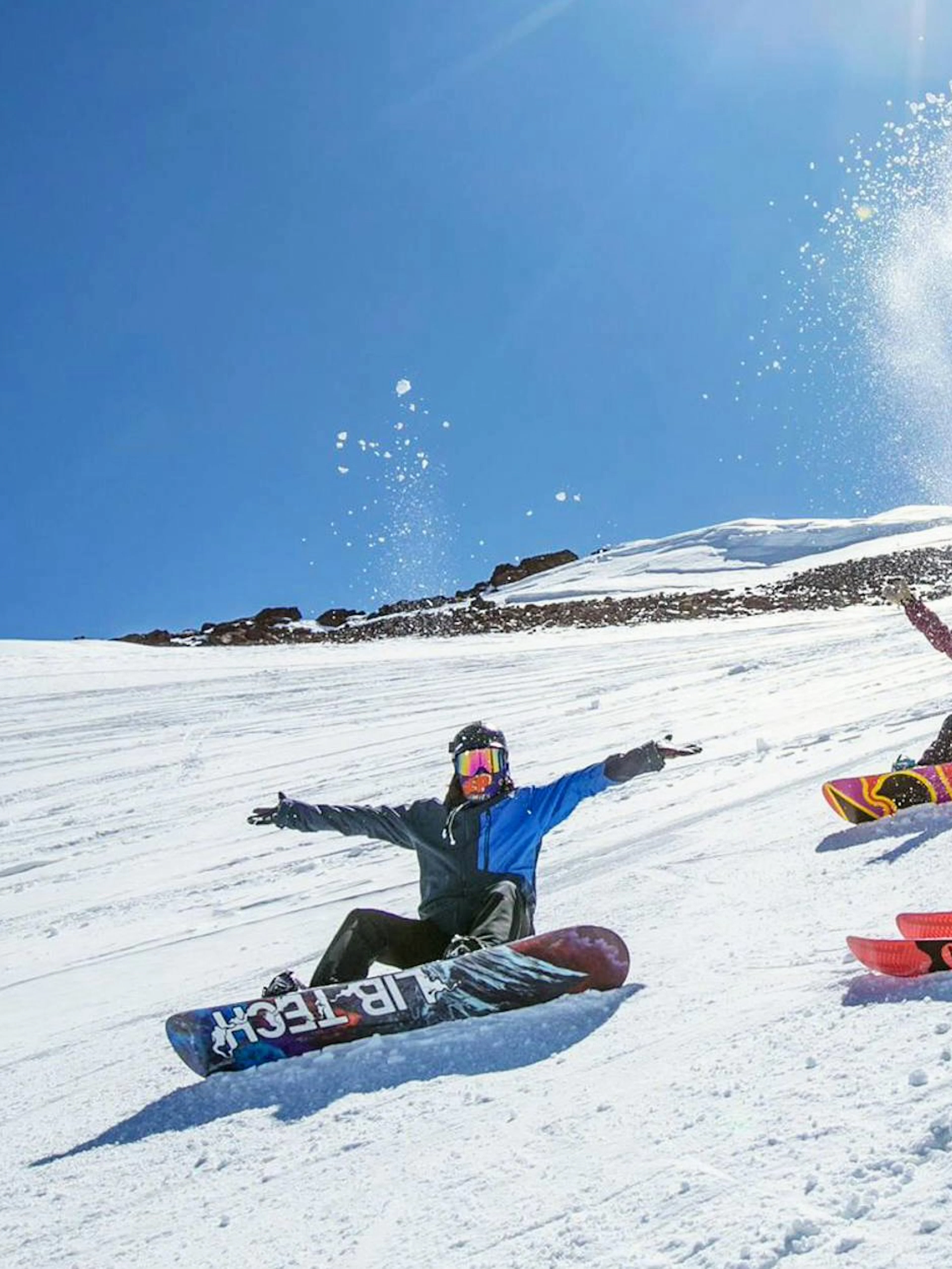Visitors sliding on snow at El Colorado Ski resort.