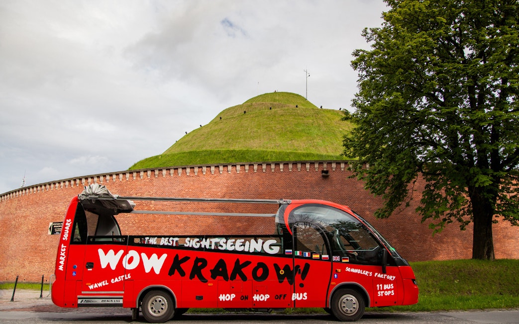 Red Kraków hop-on hop-off bus near Kościuszko Mound, Kraków.