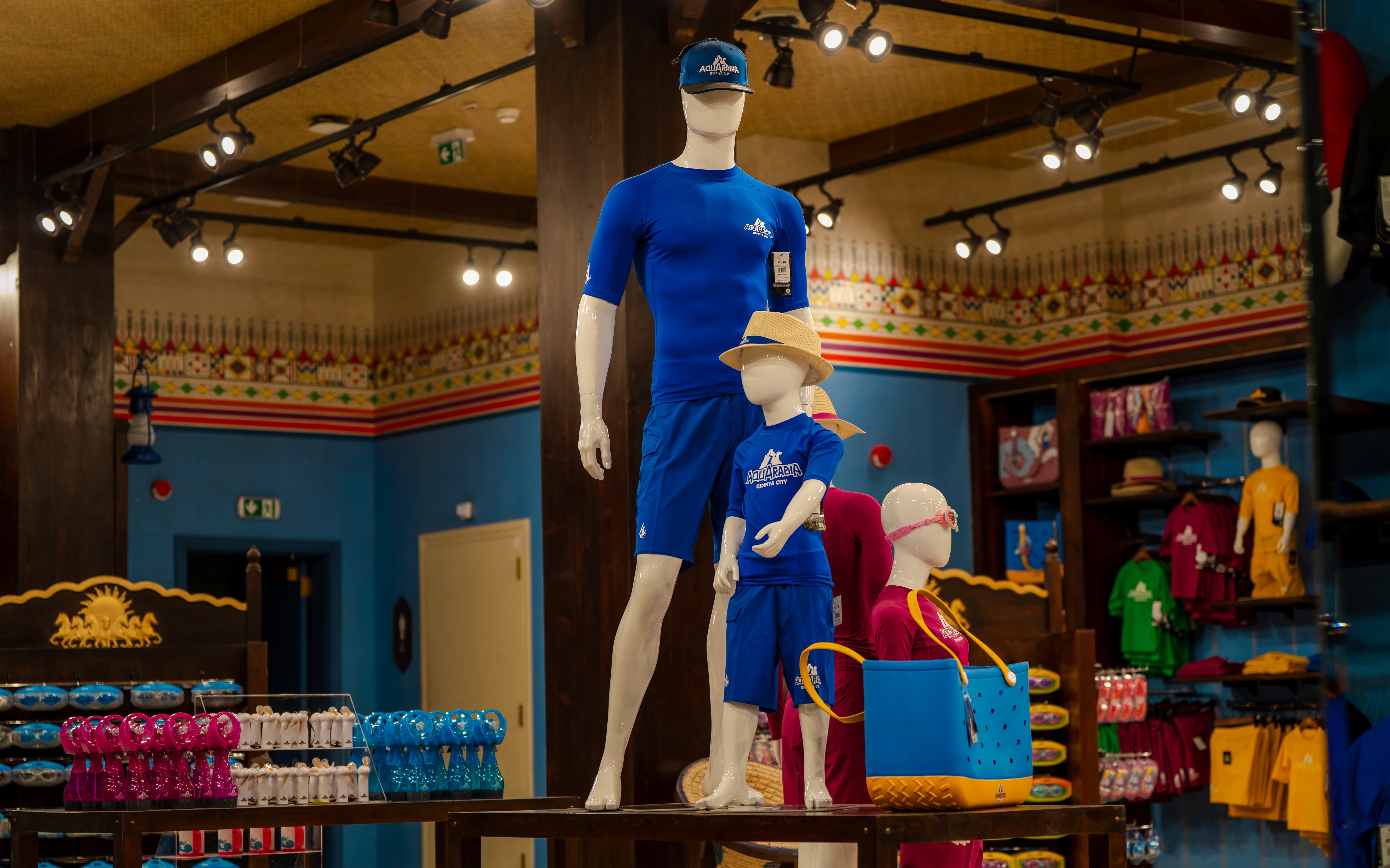 Aquarabia Water Theme Park store in Qiddiya City with mannequins in blue swimwear.