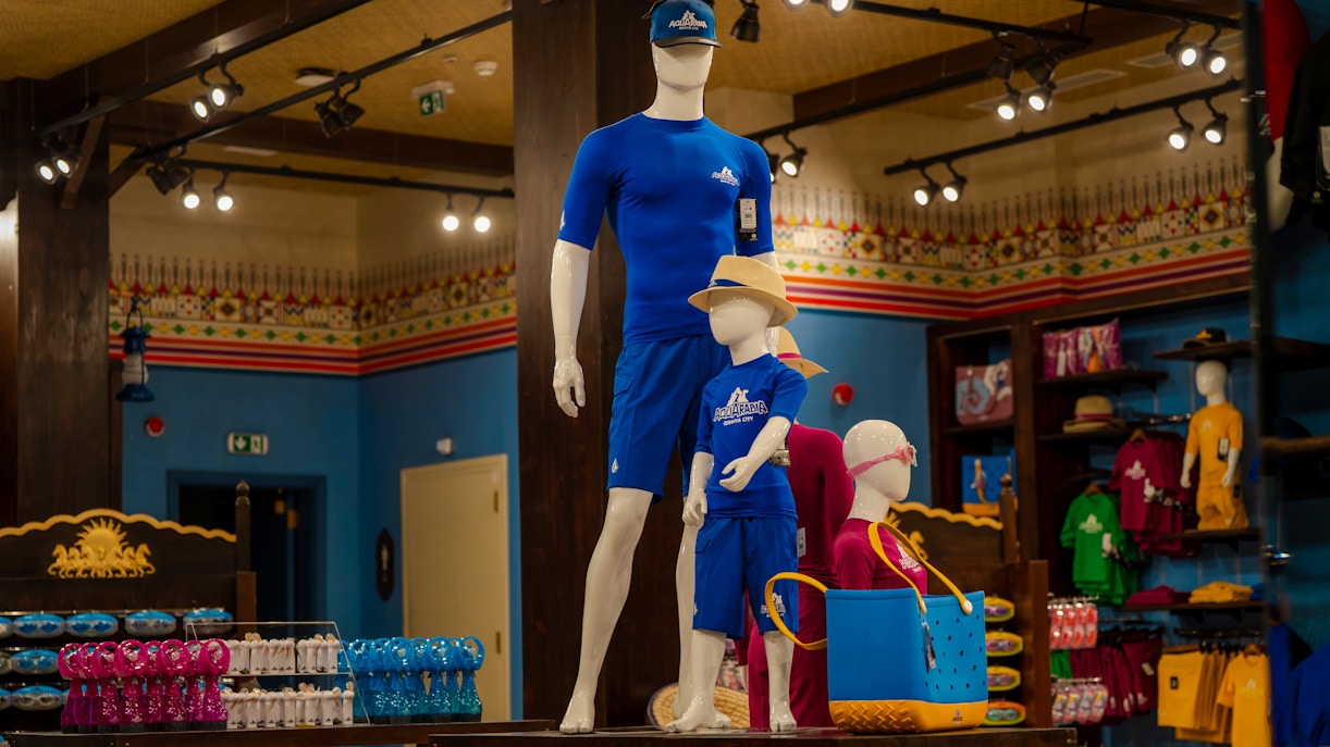 Aquarabia Water Theme Park store in Qiddiya City with mannequins in blue swimwear.