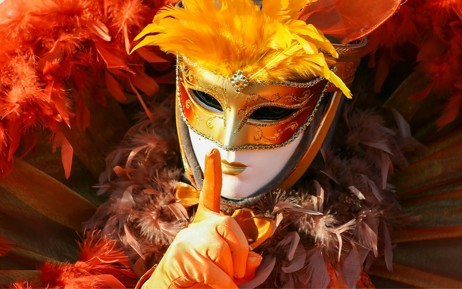 People in elaborate masks and costumes at Venice Carnival, Italy.