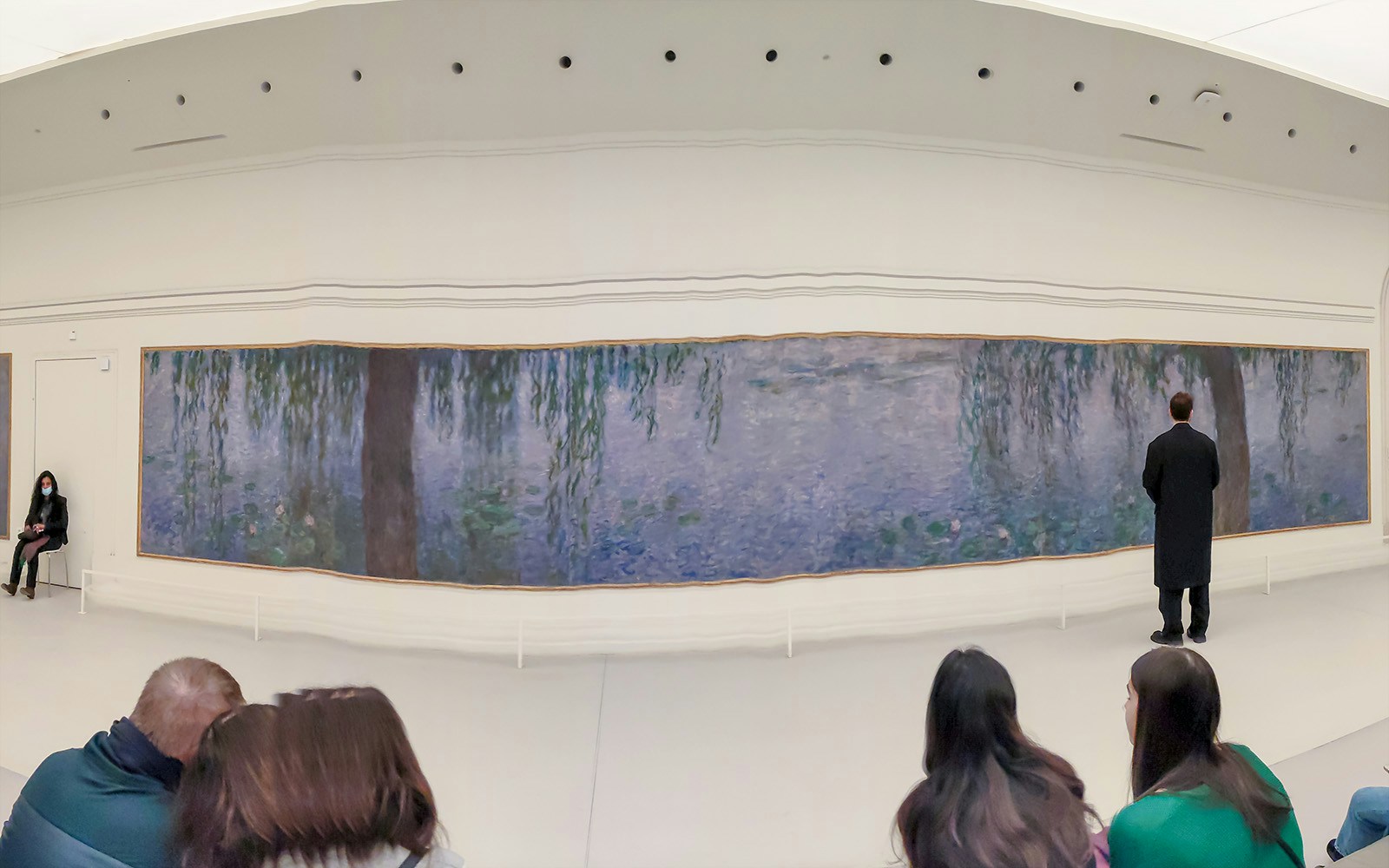 Orangerie Museum interior with Monet's Water Lilies exhibit in Paris, France.