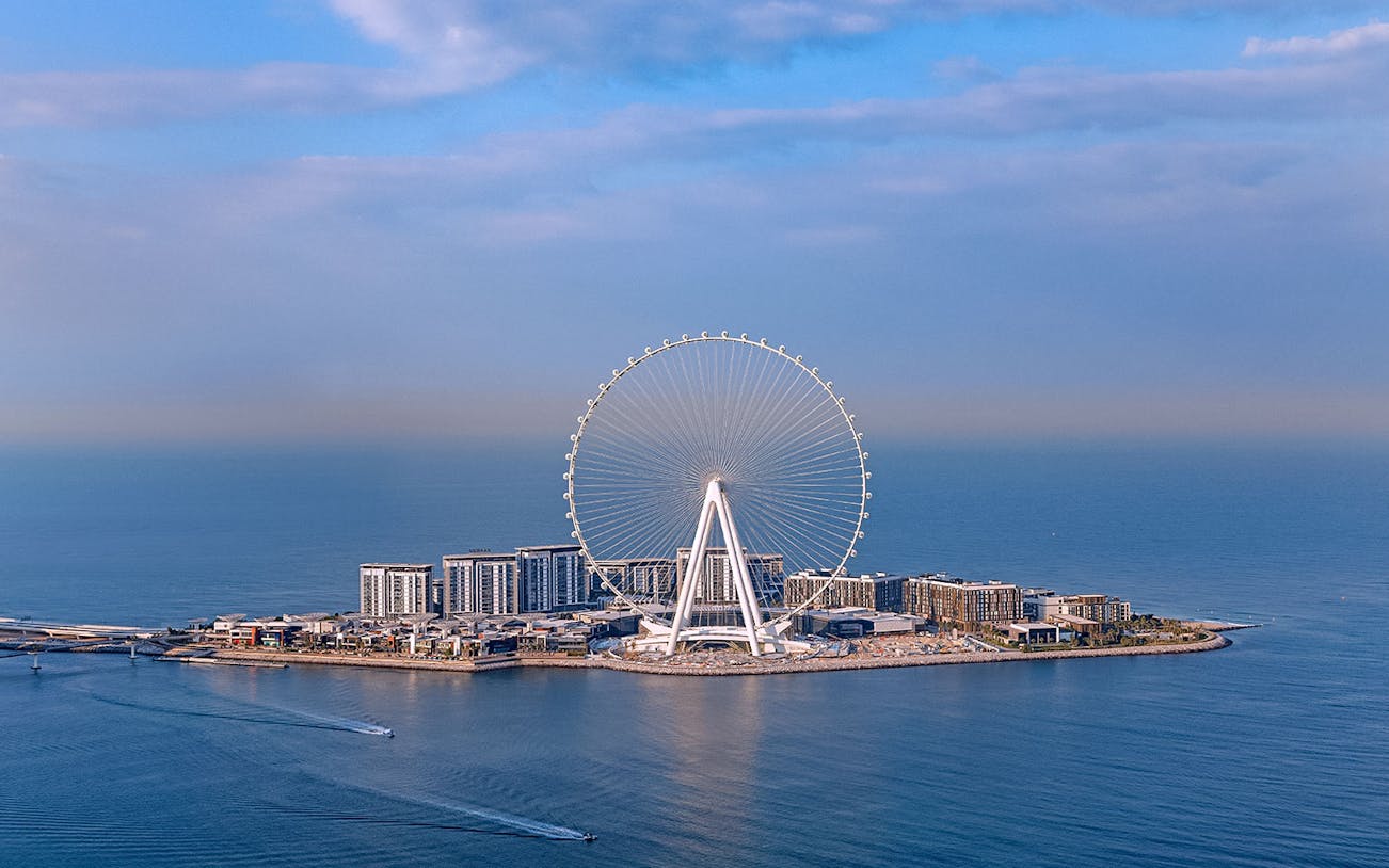 Ain Dubai Ferris wheel on Bluewaters Island, Dubai, with surrounding sea and skyline.