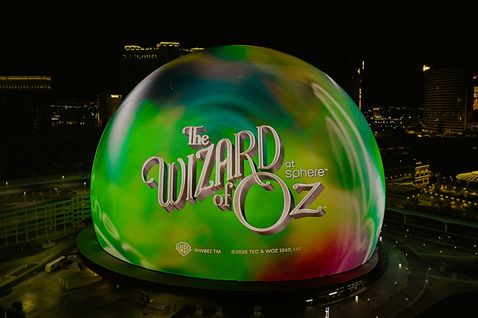 Wizard of Oz show displayed on illuminated Sphere in Las Vegas at night.