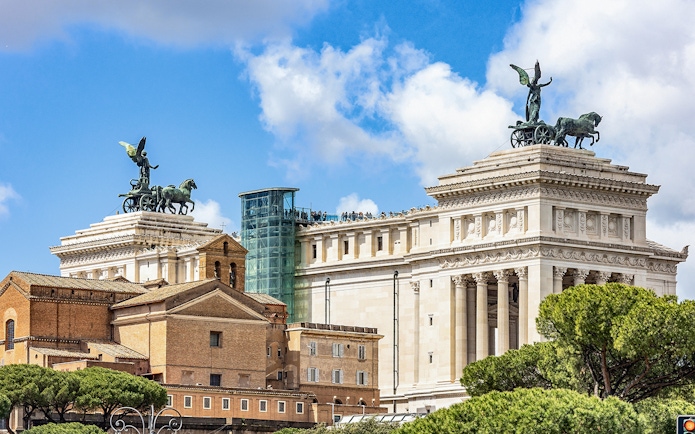 Altare della Patria with glass elevator and rooftop view in Rome, Italy.