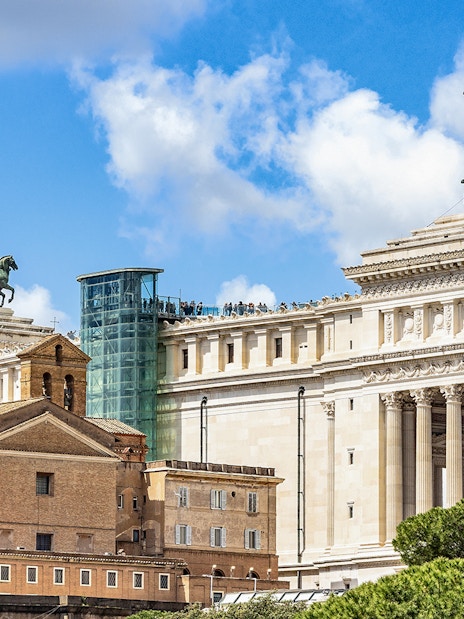 Altare della Patria with glass elevator and rooftop view in Rome, Italy.