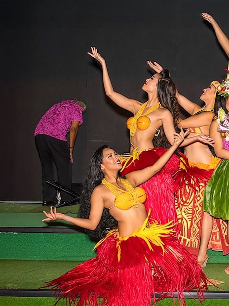 Performers in traditional attire at Paradise Cove Luau, Hawaii.
