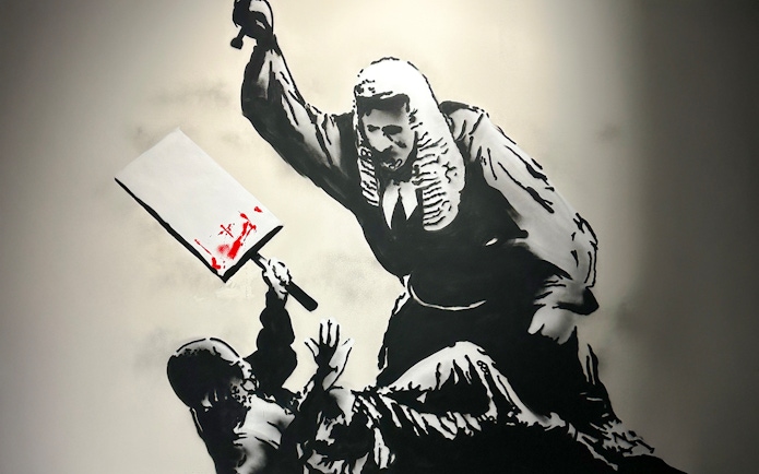 Judge with cleaver in Banksy artwork, featuring red paint splatter.