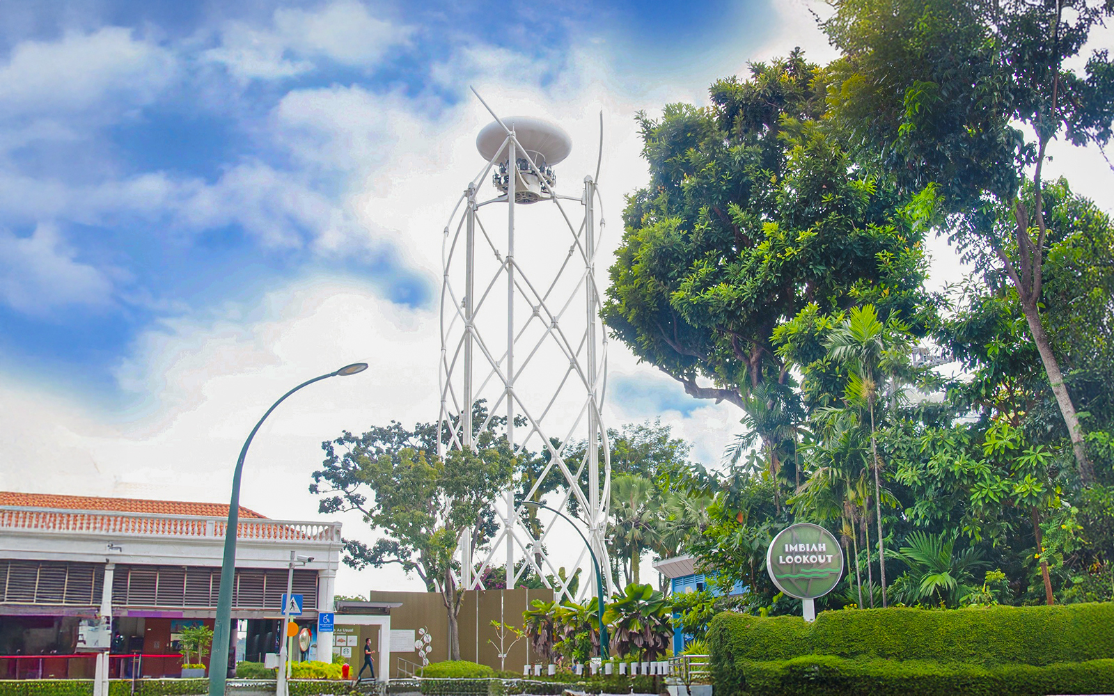Skyhelix tower at Imbiah Lookout surrounded by trees, Sentosa, Singapore.
