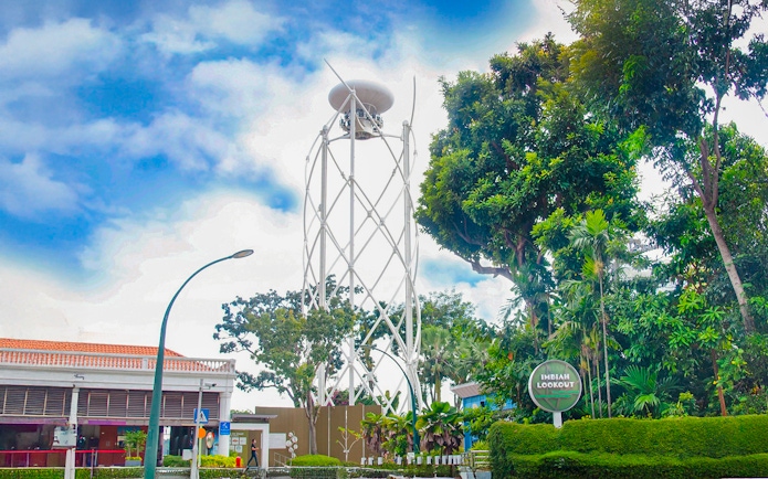 Skyhelix tower at Imbiah Lookout surrounded by trees, Sentosa, Singapore.