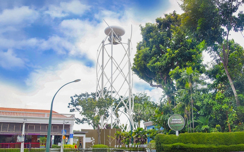 Skyhelix tower at Imbiah Lookout surrounded by trees, Sentosa, Singapore.