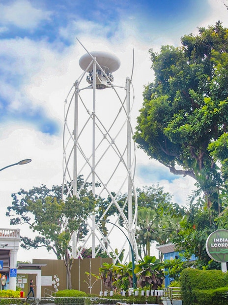 Skyhelix tower at Imbiah Lookout surrounded by trees, Sentosa, Singapore.