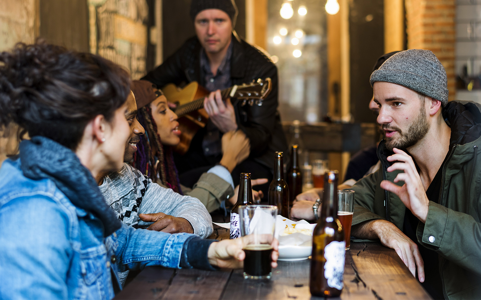 Group enjoying drinks and conversation at a Mornington Peninsula distillery tour.