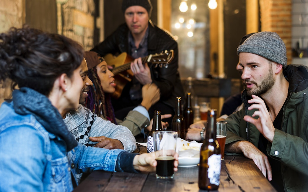 Group enjoying drinks and conversation at a Mornington Peninsula distillery tour.