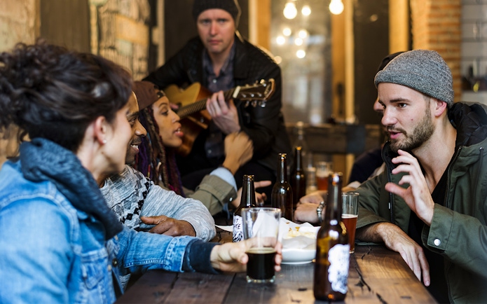 Group enjoying drinks and conversation at a Mornington Peninsula distillery tour.