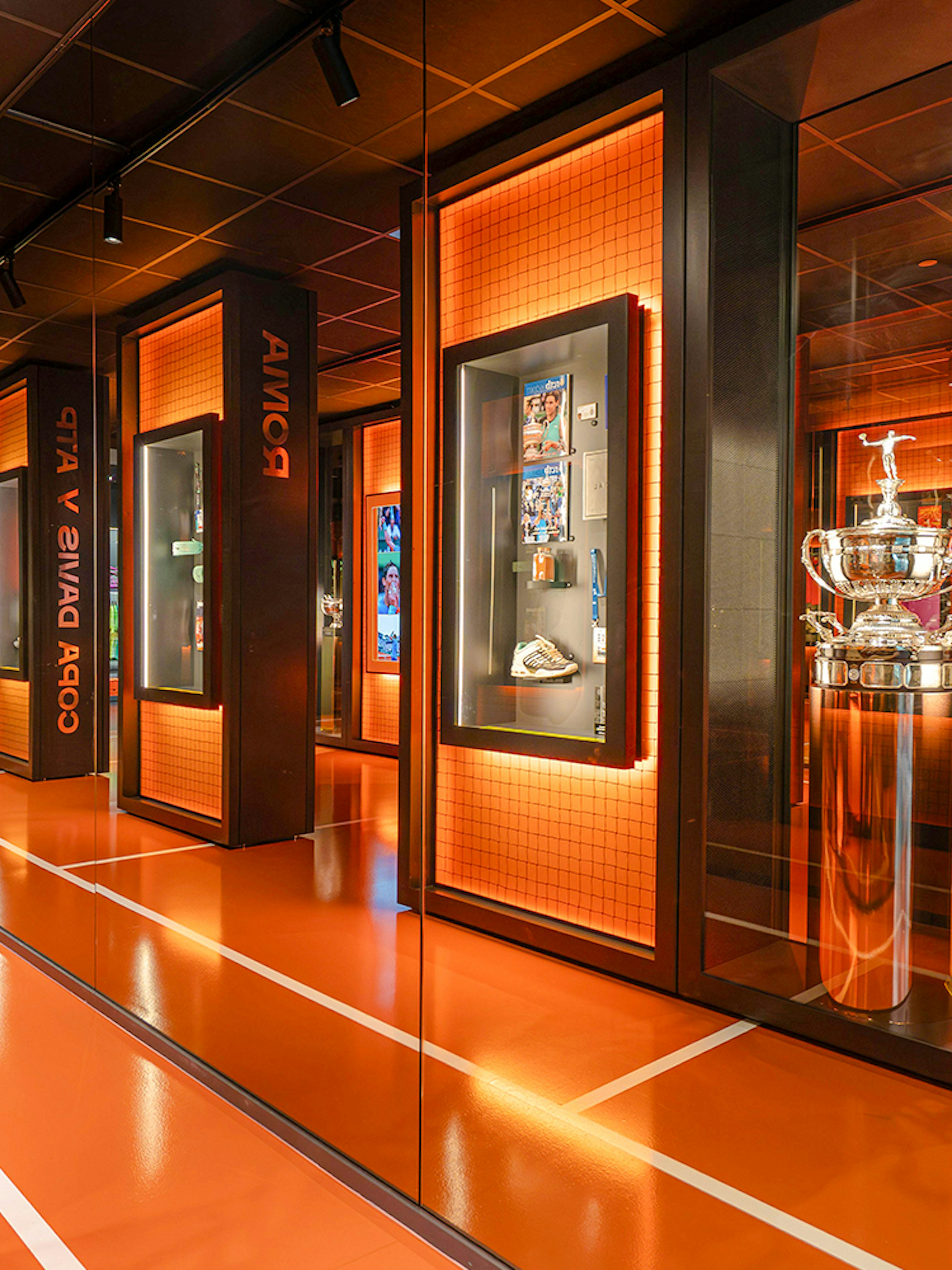 Rafa Nadal Museum interior with tennis trophies and memorabilia displays.