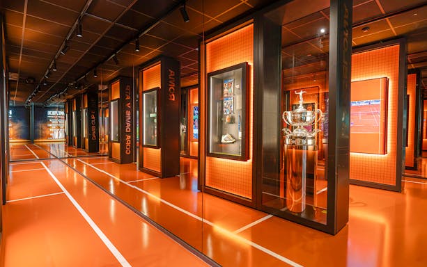 Rafa Nadal Museum interior with tennis trophies and memorabilia displays.