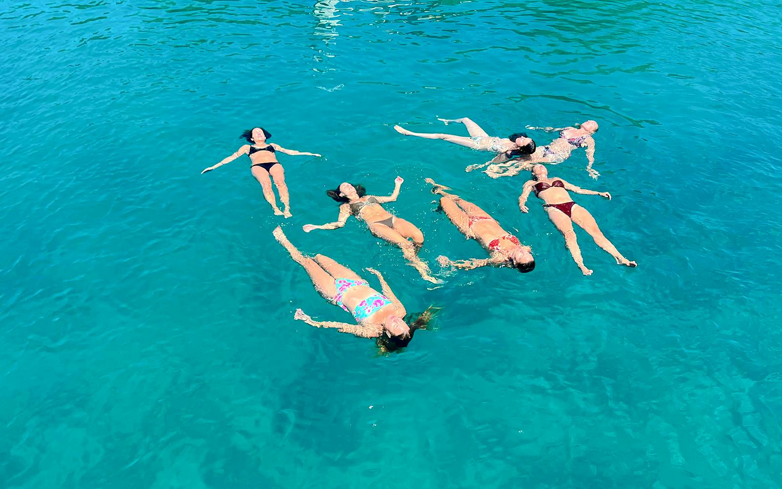 Guests swimming in clear waters during Blue Lagoon boat tour from Split.