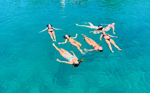 Guests swimming in clear waters during Blue Lagoon boat tour from Split.