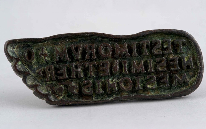 Bronze bread stamp with inscriptions, Roman or Byzantine era.