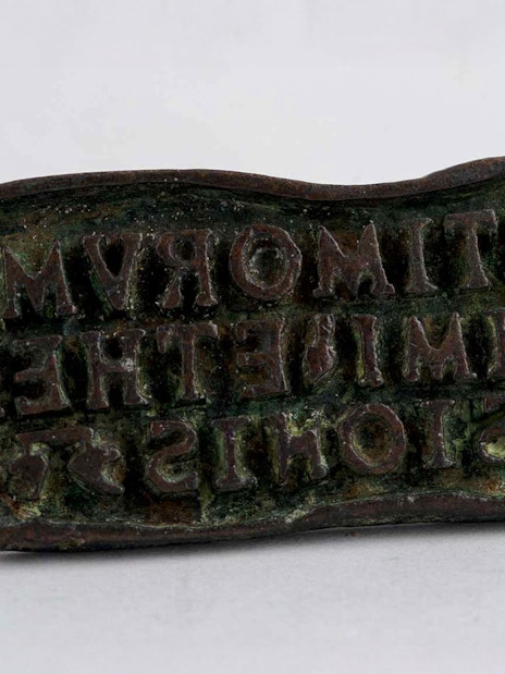 Bronze bread stamp with inscriptions, Roman or Byzantine era.