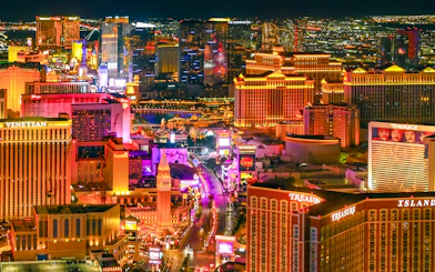 Las Vegas Strip illuminated at night, view from helicopter tour.