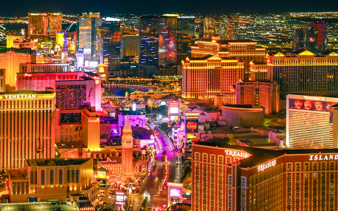 Las Vegas Strip illuminated at night, view from helicopter tour.