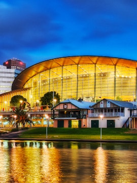 Adelaide Oval illuminated at night, reflecting on the river, South Australia.