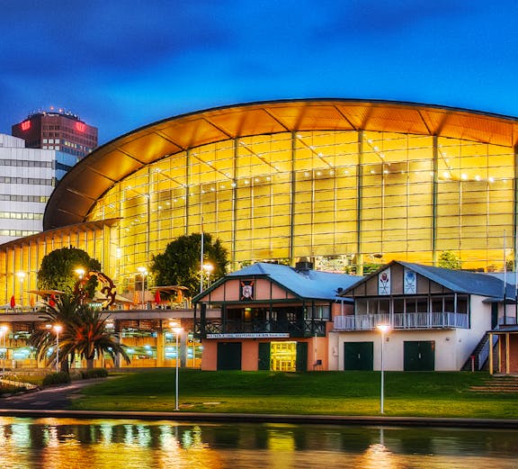 Adelaide Oval illuminated at night, reflecting on the river, South Australia.
