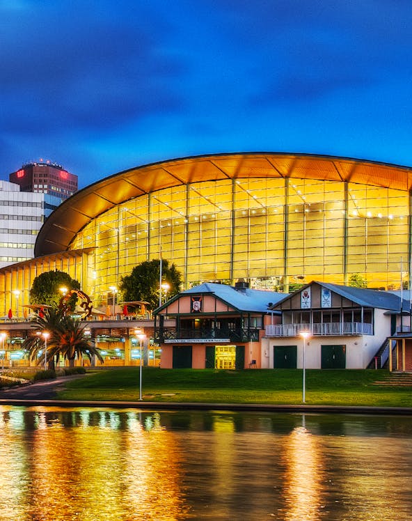 Adelaide Oval illuminated at night, reflecting on the river, South Australia.