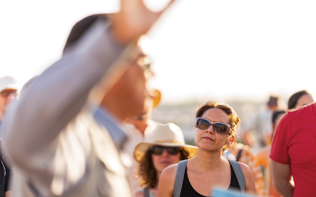 Tour group observing the Changing of the Guard near Westminster Abbey, London.