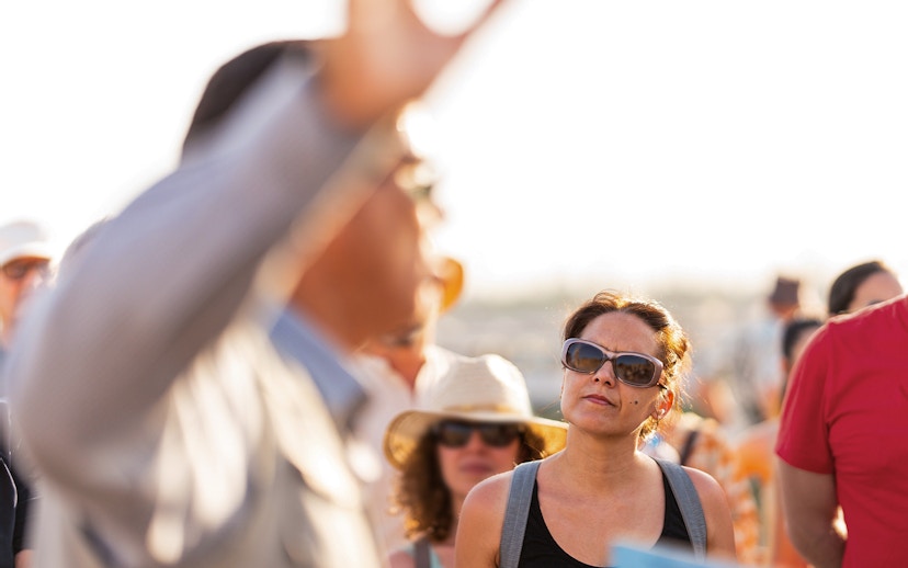 Tour group observing the Changing of the Guard near Westminster Abbey, London.
