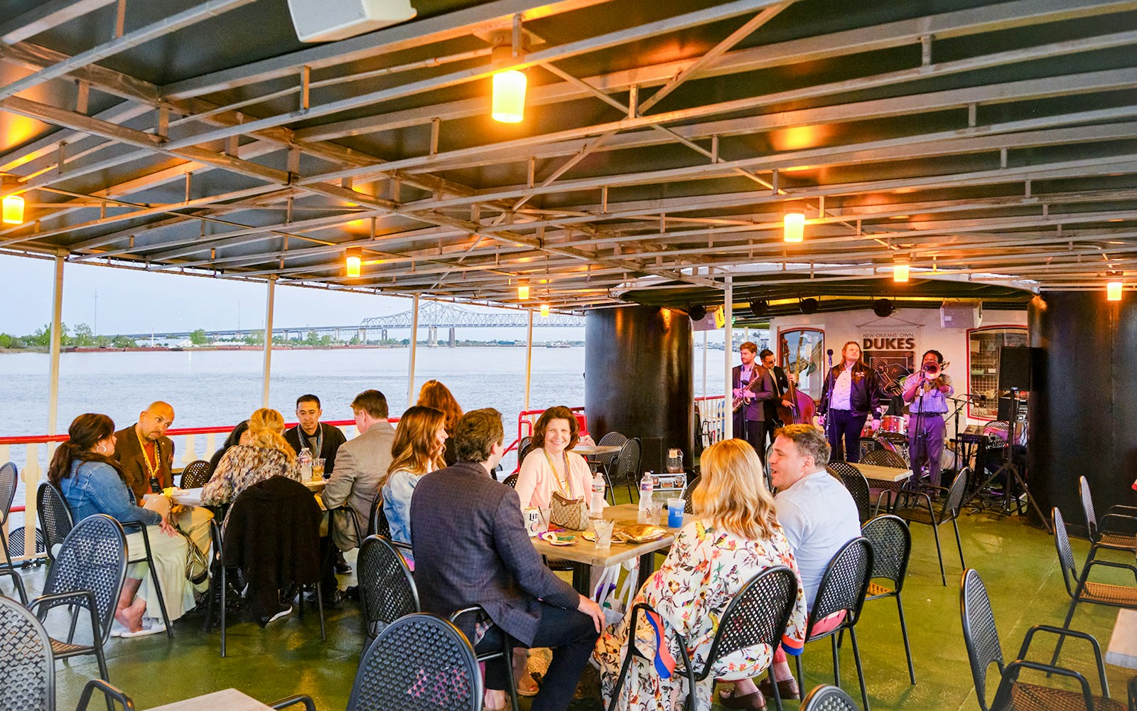 People sitting and eating on Steamboat Natches with a view